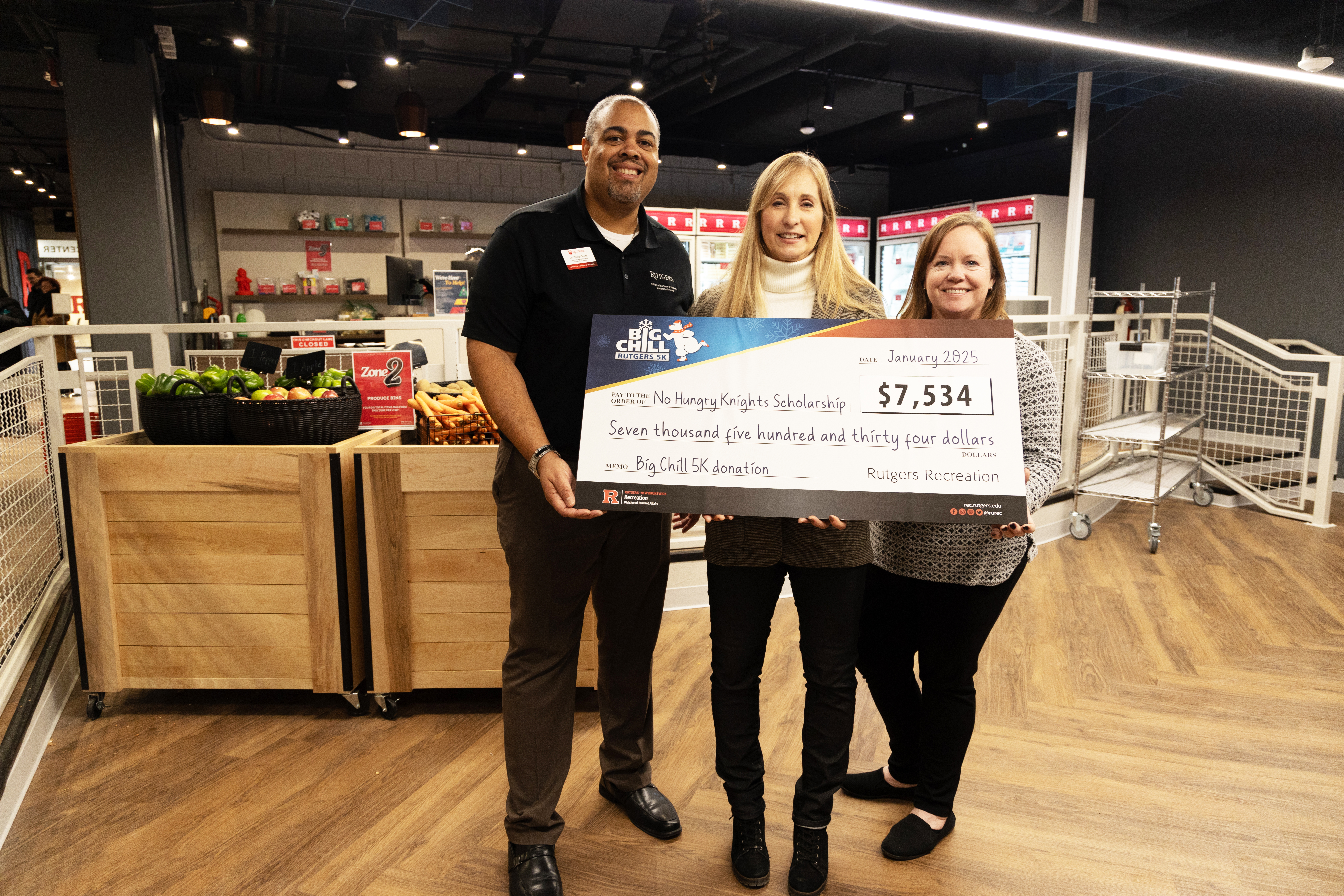 Anne Finetto, Race Director for The Rutgers Big Chill 5K Committee, proudly presented a check on behalf of the event to Philip Smith, Assistant Dean of Students for Student Basic Needs, and Kerri Willson, Associate Dean of Students and Director of Off-Campus Living and Community Initiatives, in support of the fund.