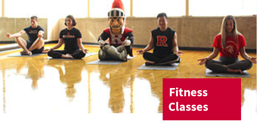 People sitting on yoga mats, Fitness Classes