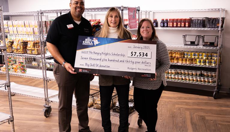  Anne Finetto, Race Director for The Rutgers Big Chill 5K Committee, proudly presented a check on behalf of the event to Philip Smith, Assistant Dean of Students for Student Basic Needs, and Kerri Willson, Associate Dean of Students and Director of Off-Campus Living and Community Initiatives, in support of the fund.  